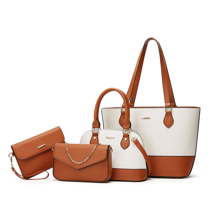 Set of brown and white handbags on a white background